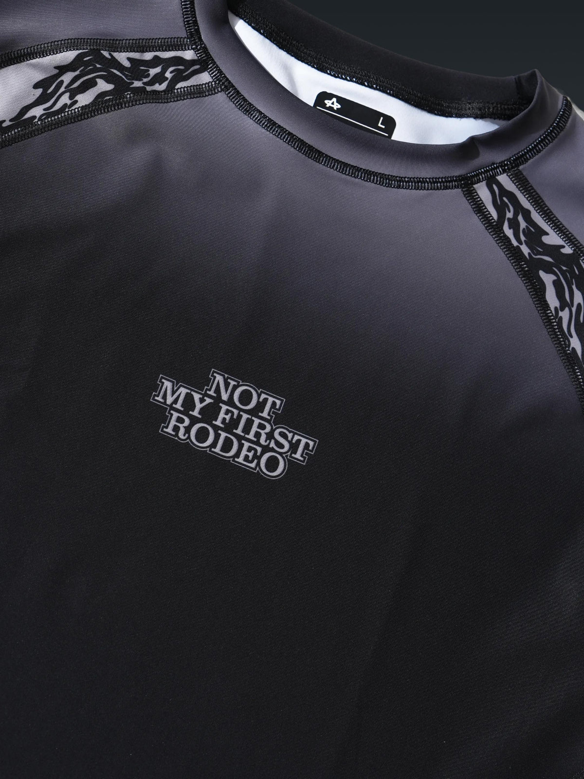Not My First Rodeo After Dark rashguard, chest detail