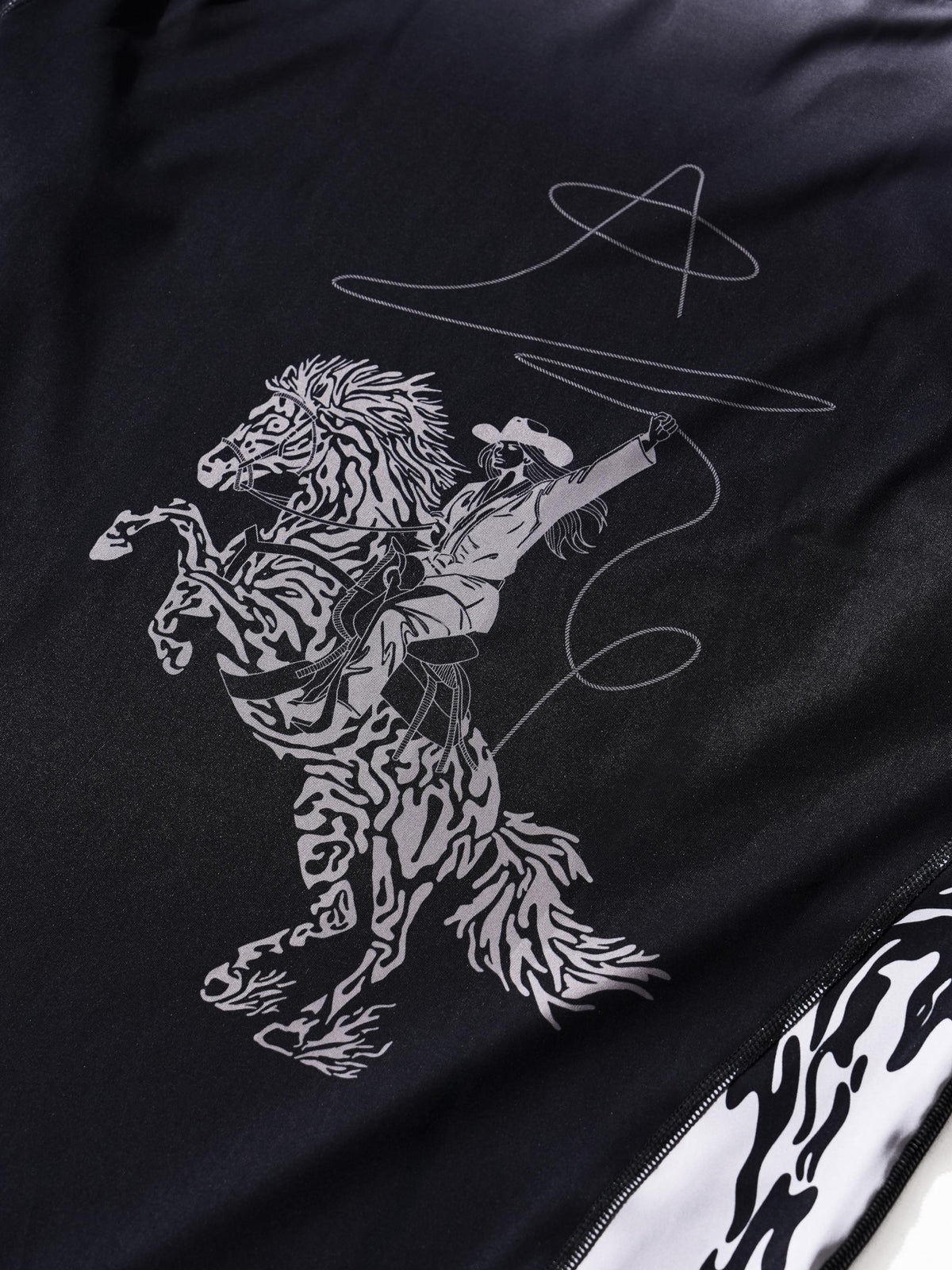 Not My First Rodeo After Dark rashguard, back rider detail