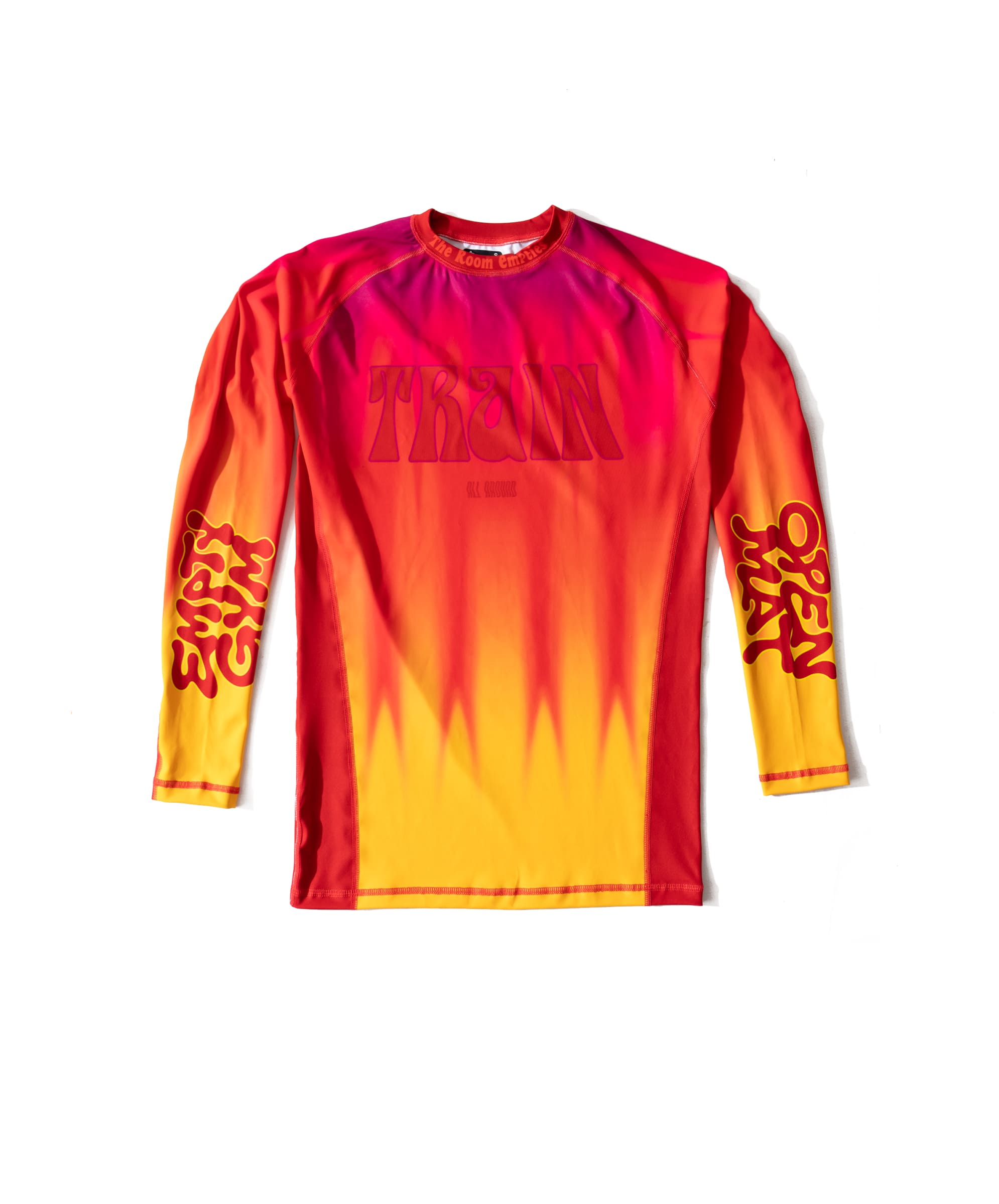While They Tan rashguard, front — heat-haze gradient from magenta at the shoulders to yellow at the hem, TRAIN in seventies poster lettering across the chest.