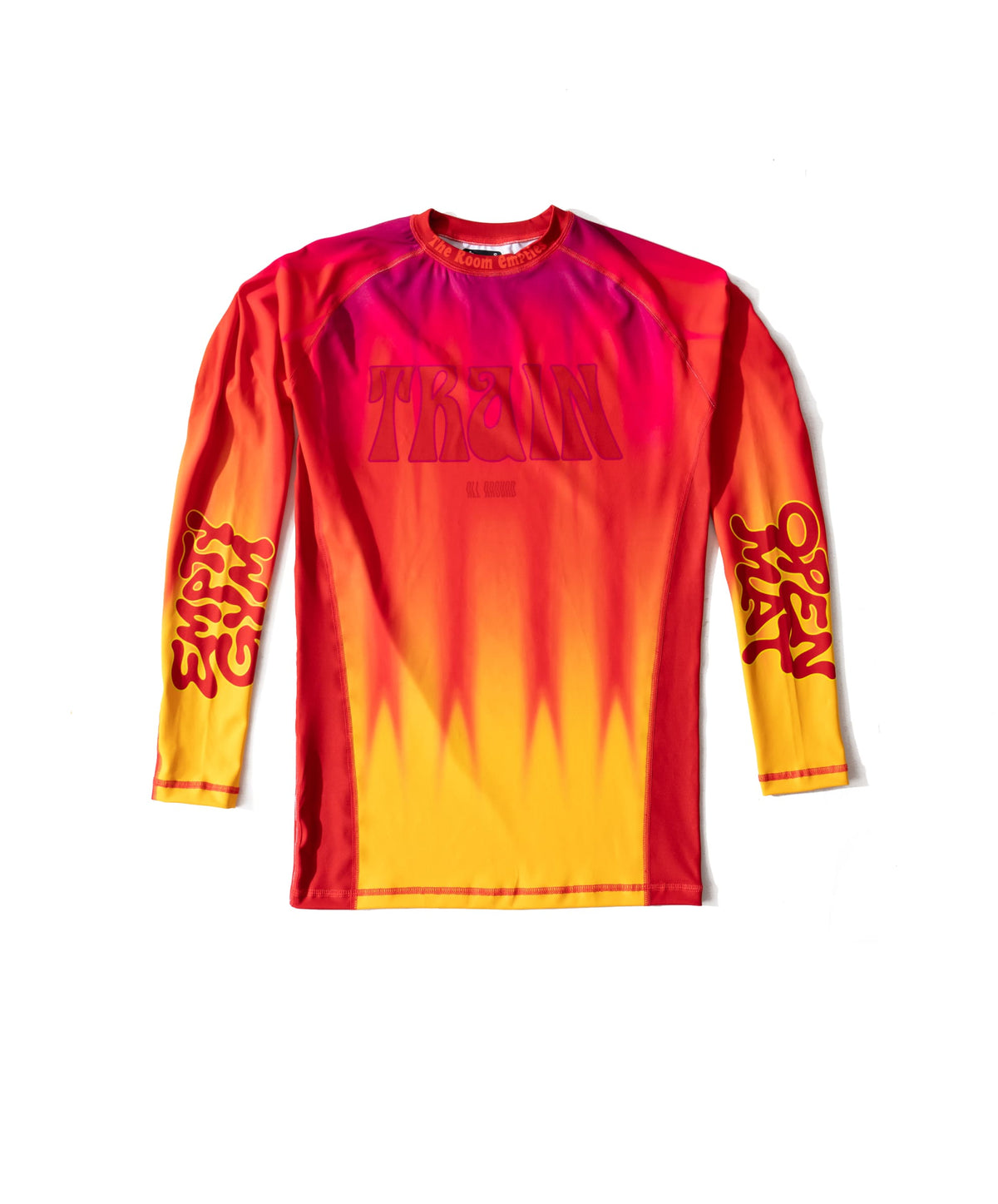 While They Tan rashguard, front — heat-haze gradient from magenta at the shoulders to yellow at the hem, TRAIN in seventies poster lettering across the chest.