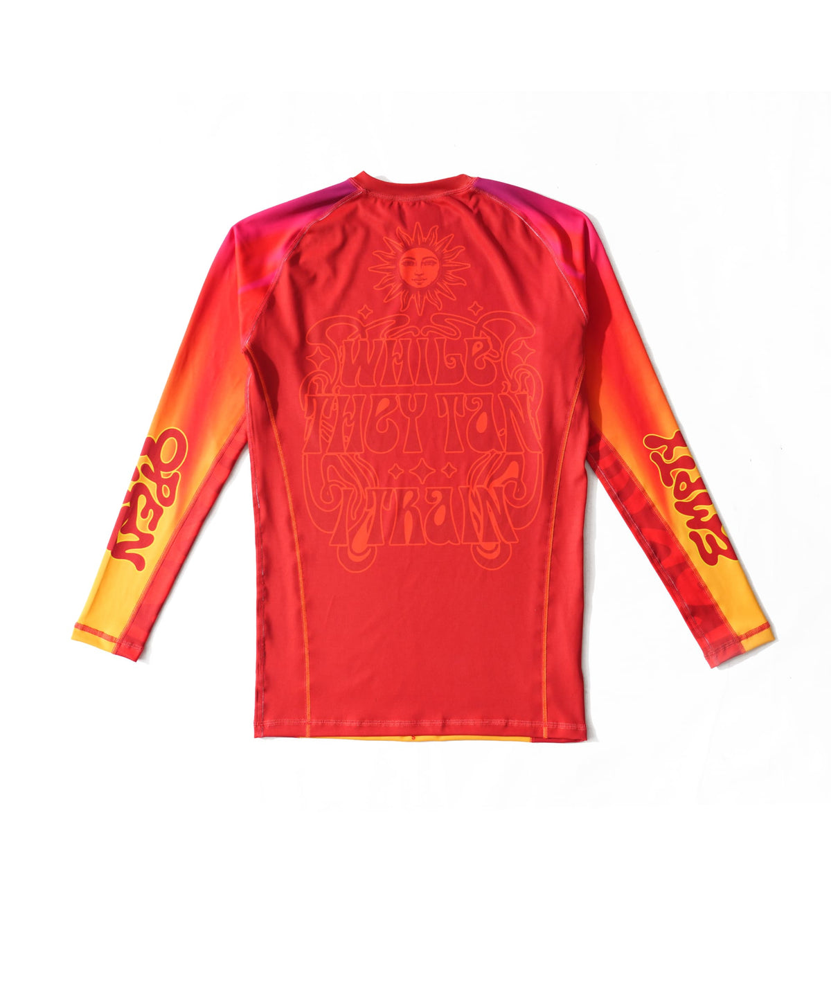 While They Tan rashguard, back — tonal red-on-red sun-face above WHILE THEY TAN / TRAIN in poster lettering.
